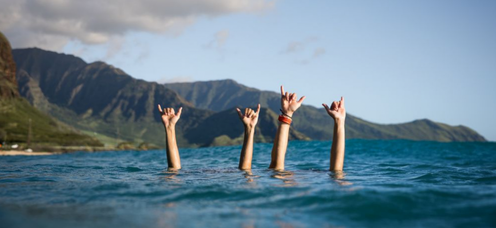 Surfers shaka